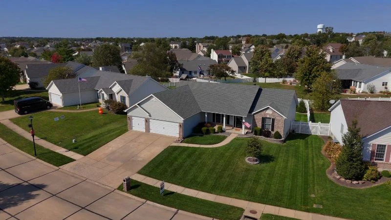 Brick-and-siding ranch home with a three-car garage and a Gateway Realty Group yard sign, one of the team's previous listings in O'Fallon, MO