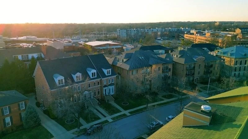 Aerial view of townhome-style detached homes on compact lots in Clayton, Missouri