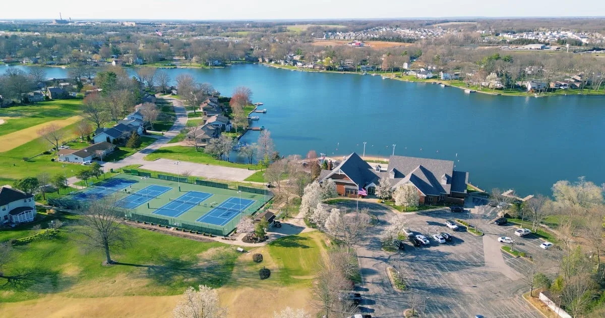 Aerial view of the Lake St. Louis Community Association clubhouse and tennis courts