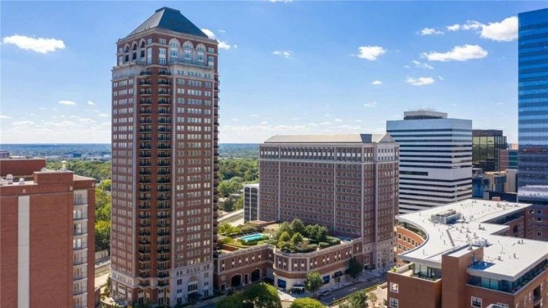 The Plaza, a 28-storey brick condominium tower in Clayton, with the Ritz-Carlton and its pool terrace beside it