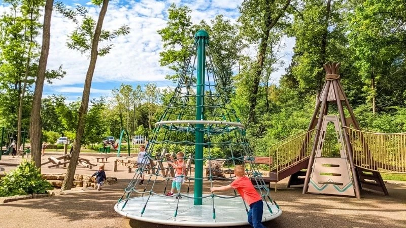Children playing on the climbing structure at Wildwood Community Park