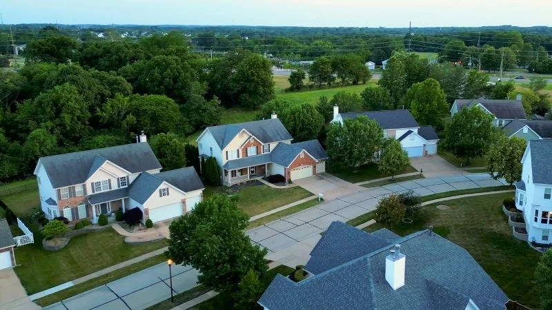 Aerial view of two-story homes on a quiet subdivision street in Wildwood, Missouri