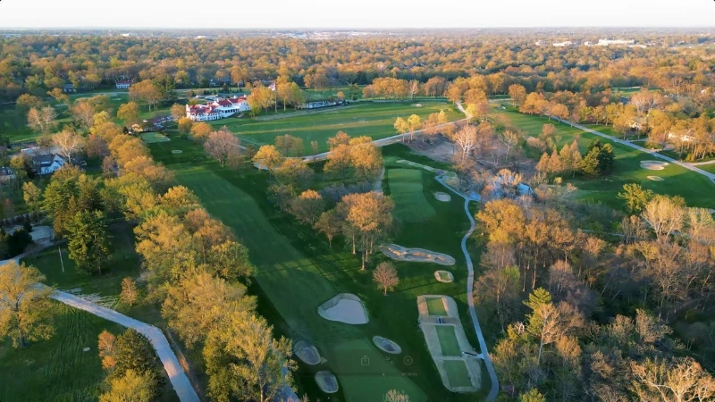 Aerial view of the St. Louis Country Club golf course and clubhouse in Ladue
