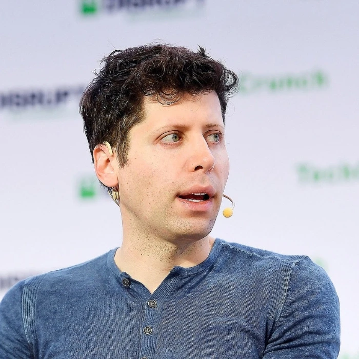 Sam Altman speaking on stage at TechCrunch Disrupt