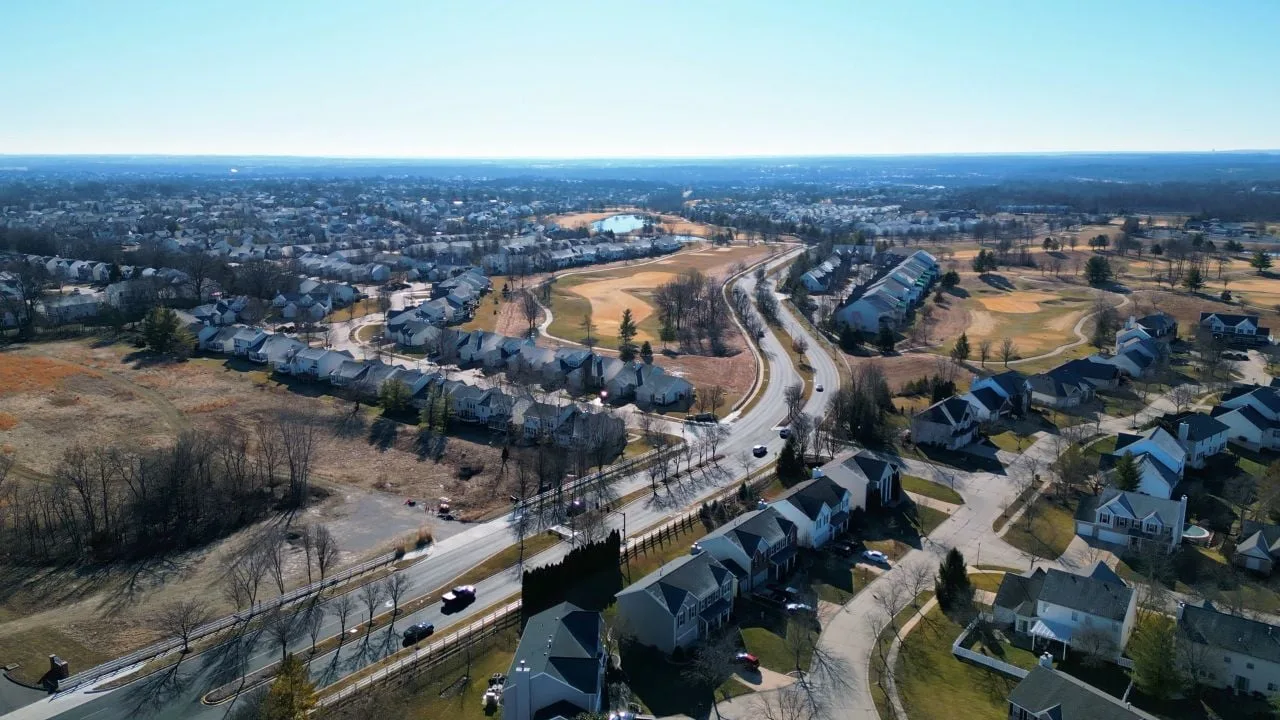 Aerial view of the WingHaven community in O'Fallon, MO, with homes lining the golf course fairways