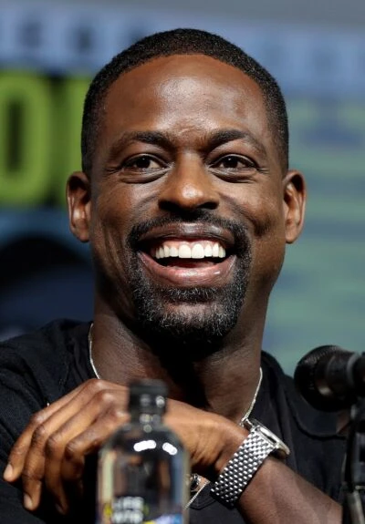 Sterling K. Brown laughing during a panel appearance