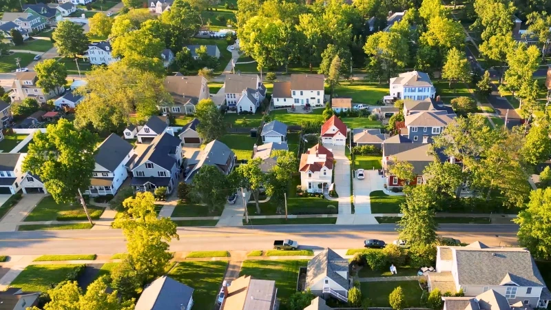 Aerial view of a Kirkwood residential street of houses set close together beneath mature trees