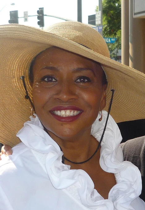 Jenifer Lewis wearing a wide-brimmed straw hat