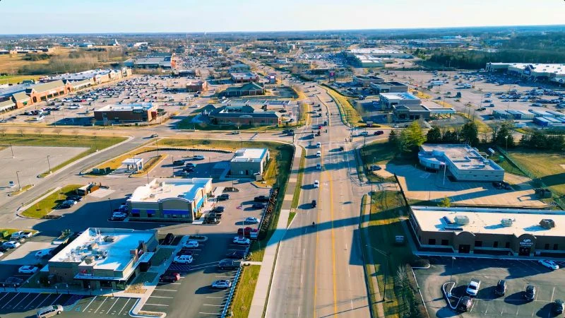 Aerial view of shopping centers and traffic along Wentzville Parkway