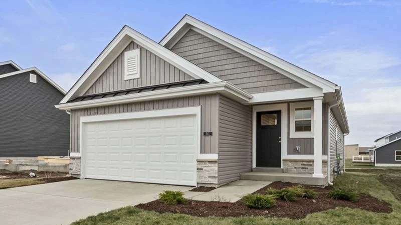Gray craftsman-style model home at Wildflower Meadows in Wentzville