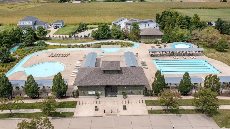 The 700-foot lazy river at the Shire Lane Pool Club, lined with palm trees