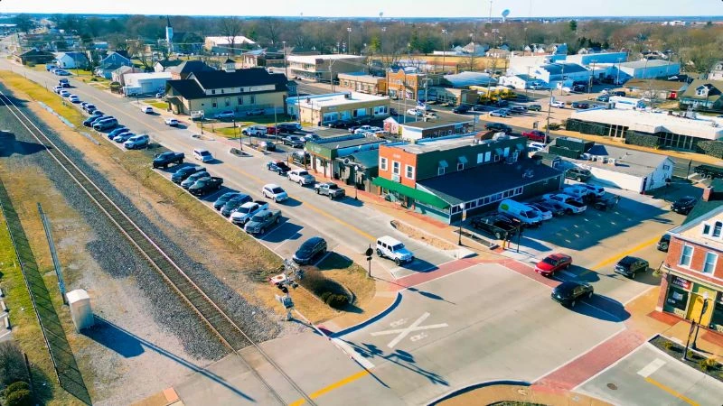 Aerial view of Main Street shops beside the railroad tracks in Historic Wentzville