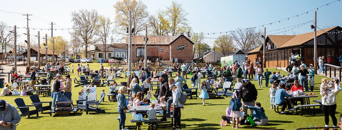 Wide view of the crowd at Gateway Realty Group's Cottleville Easter Egg Hunt at Frankie Martin's Garden