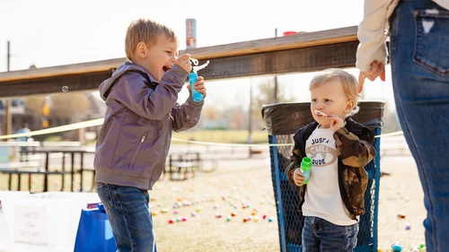 Kids blowing bubbles at the Cottleville Easter Egg Hunt