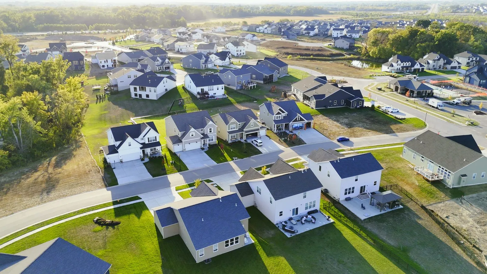 Wide aerial photograph of Cottleville Trails in October 2025 showing streets of completed homes with more of the community stretching to the horizon