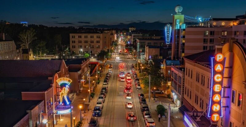 Drone shot of a lit up street at night