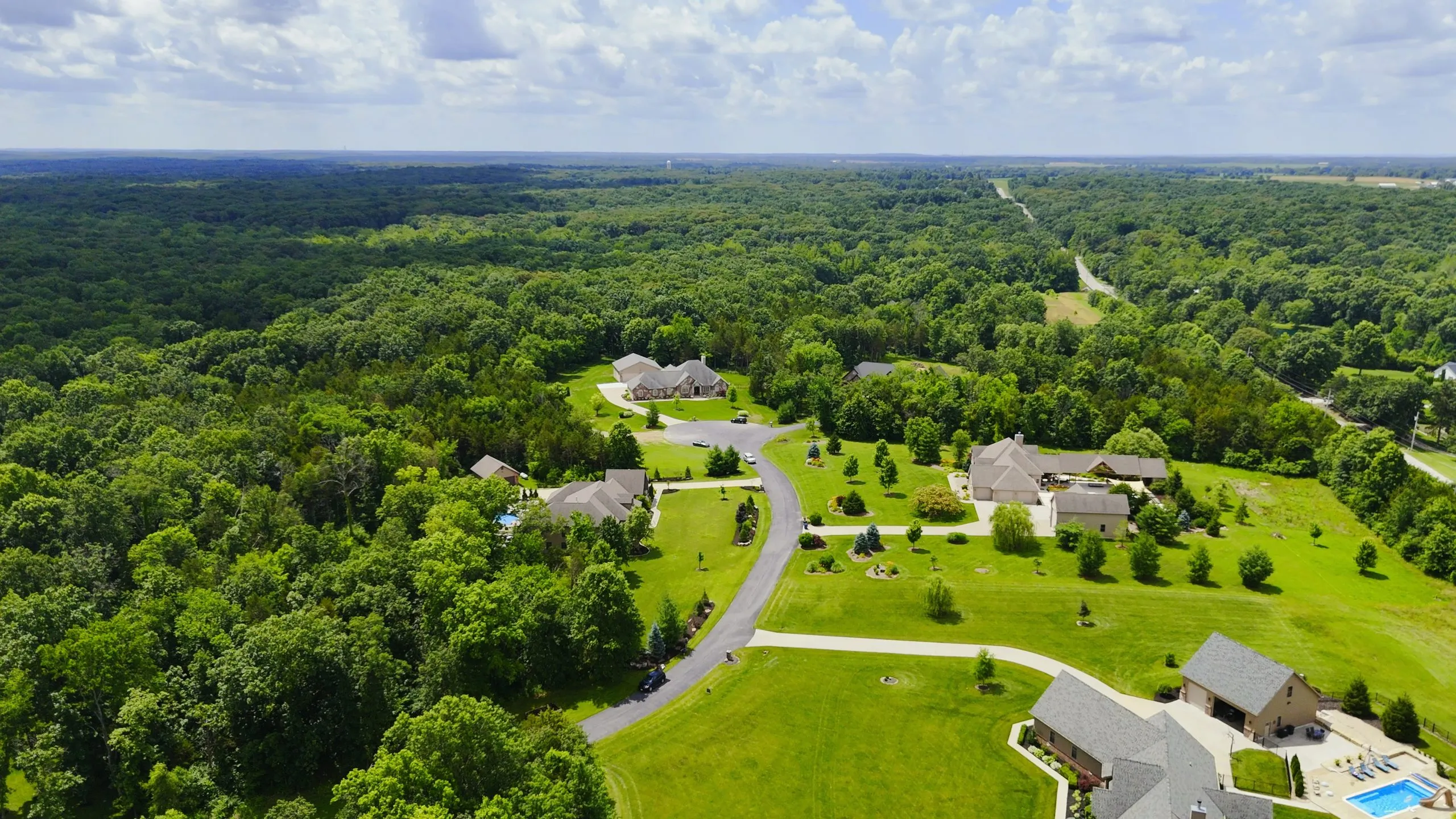 Aerial view of homes on large wooded lots in the Foristell Ridge neighborhood of Foristell, Missouri