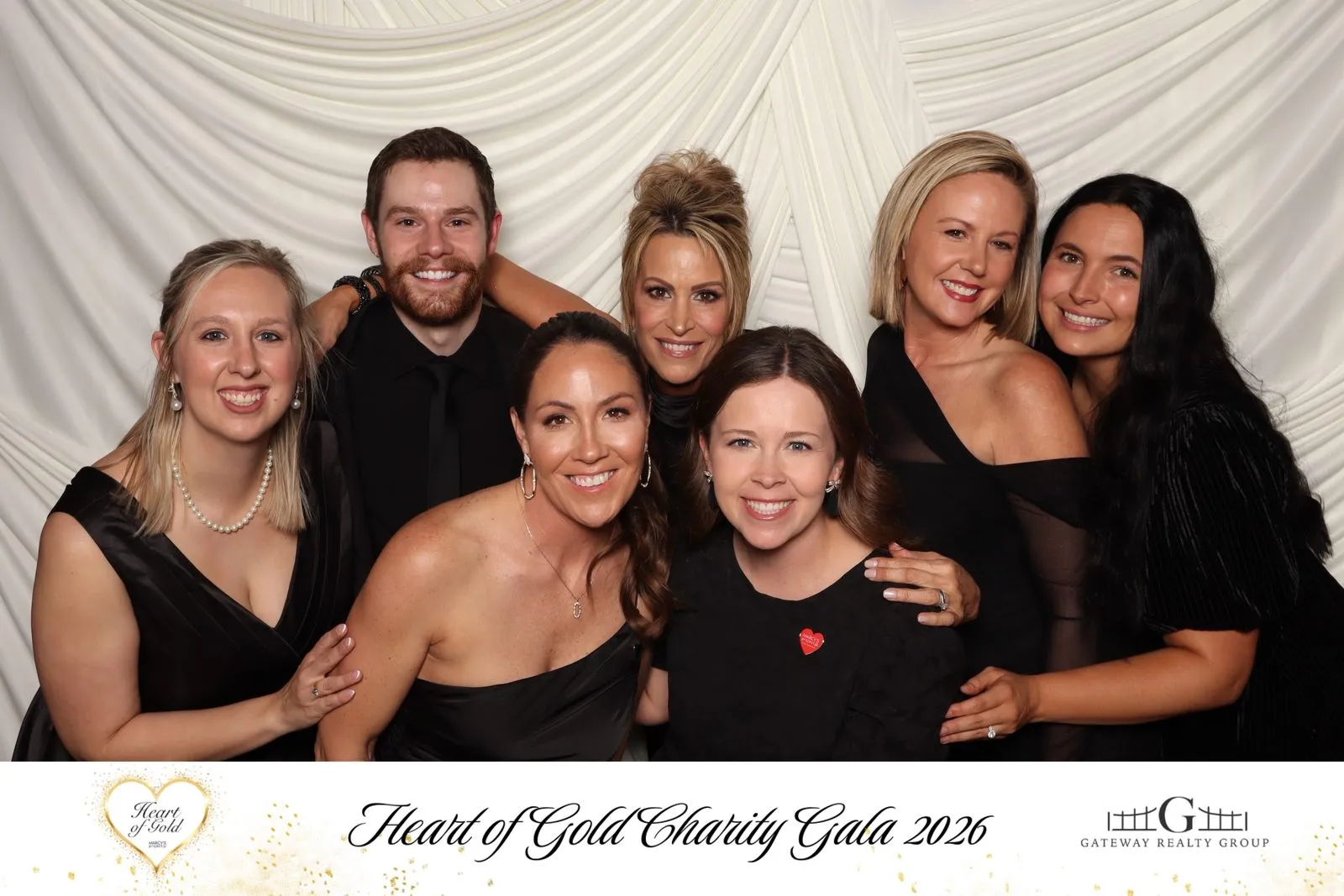 Madison Hayes and the Gateway Realty Group team in the photo booth at the Marcy's Project Heart of Gold Charity Gala in 2026