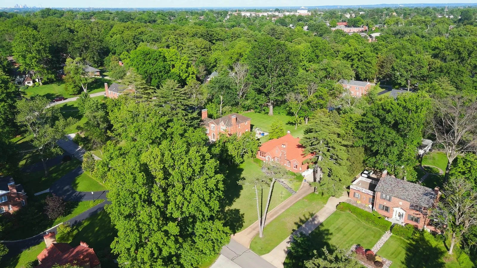 Aerial view of brick homes and mature trees along Grantwood Lane in Grantwood Village, Missouri