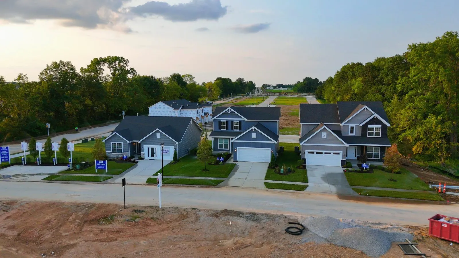 The McBride display homes at Harvest completed and landscaped in July 2024, a row of finished houses at the entrance to the community