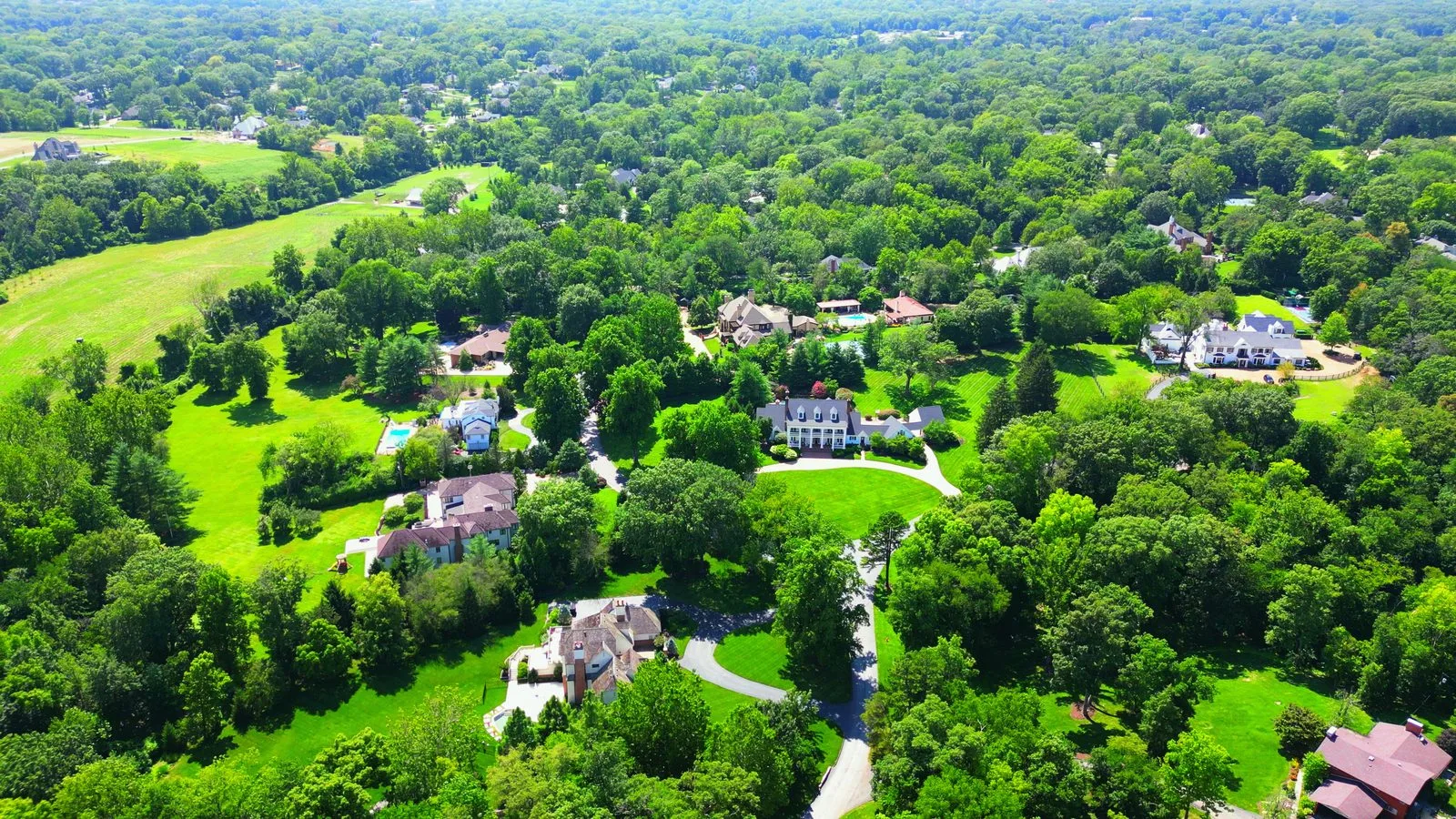 Large homes set well back from Radnor Road in Huntleigh, Missouri