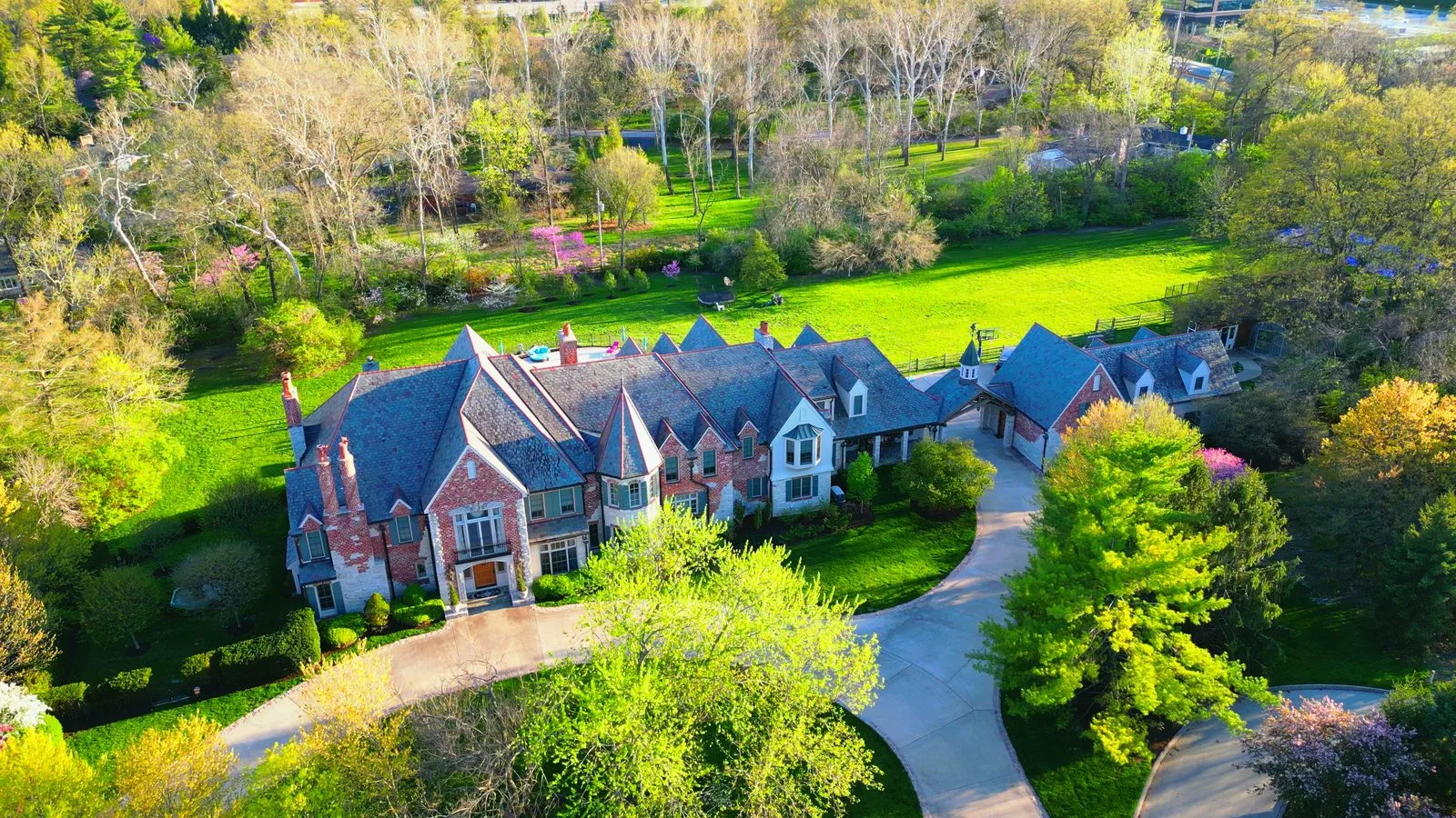 Aerial view of a large custom mansion on Winding Ridge in Ladue, Missouri