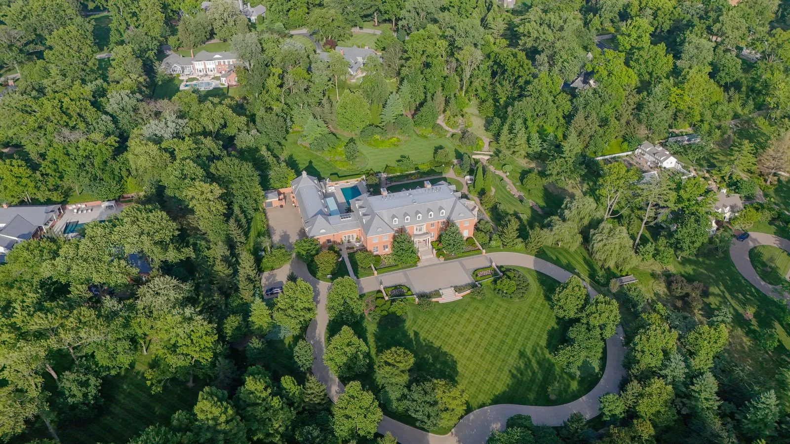 Aerial view of a brick mansion on Upper Ladue Road in Ladue, Missouri