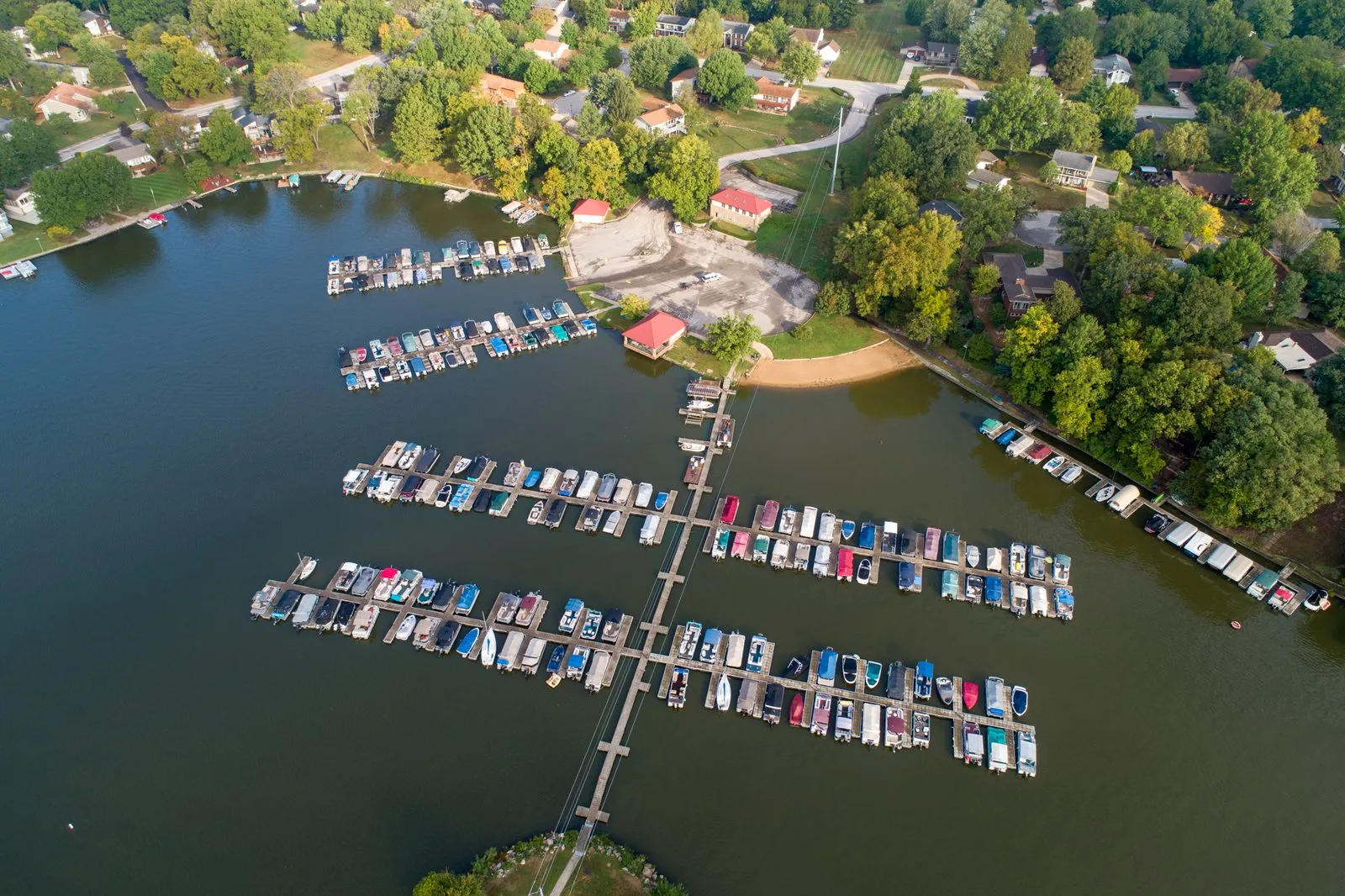 Aerial view of the Lake St. Louis Community Association main marina with every boat slip occupied