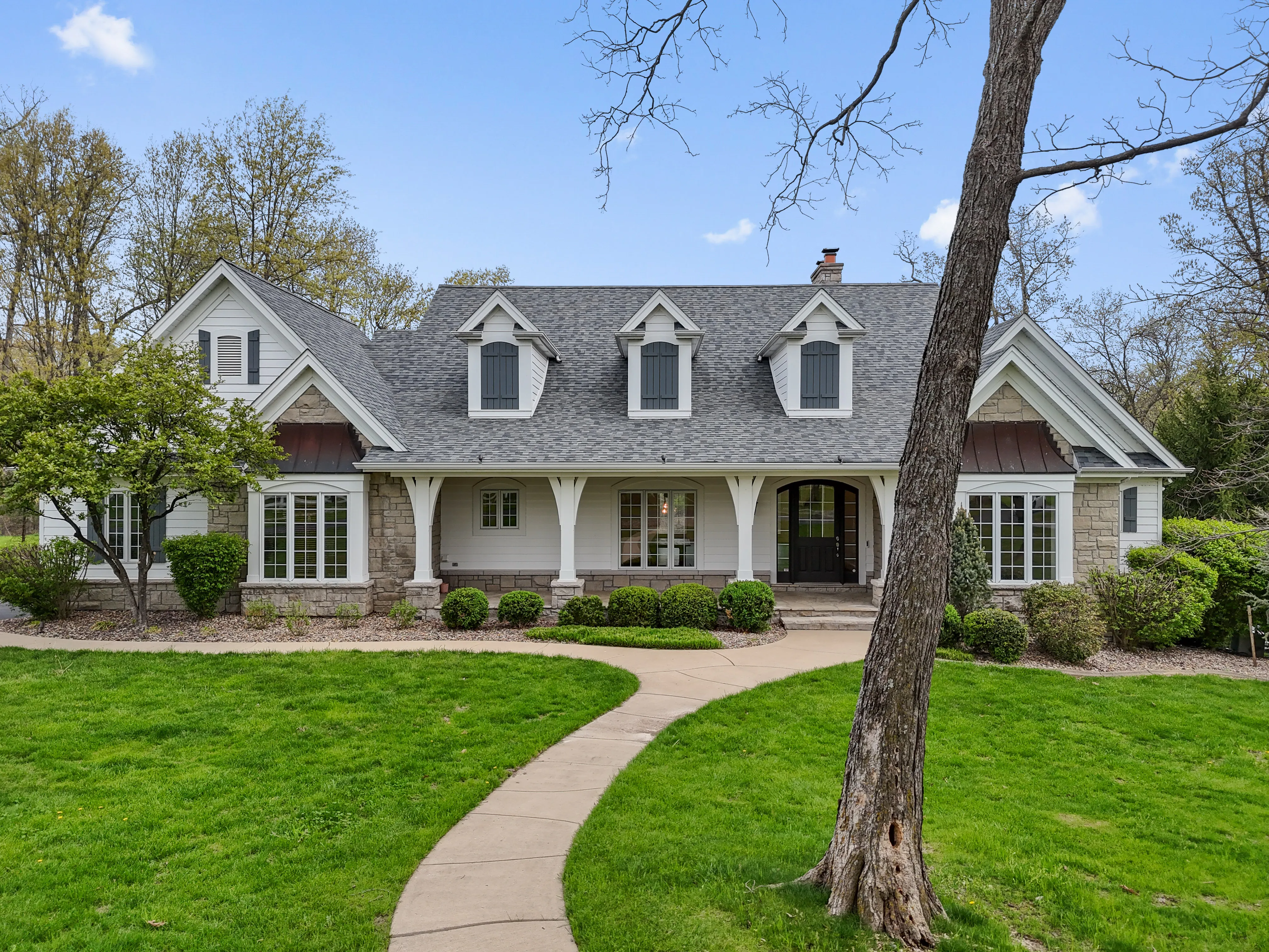 Front elevation of the white country home at 1357 Schwede Road