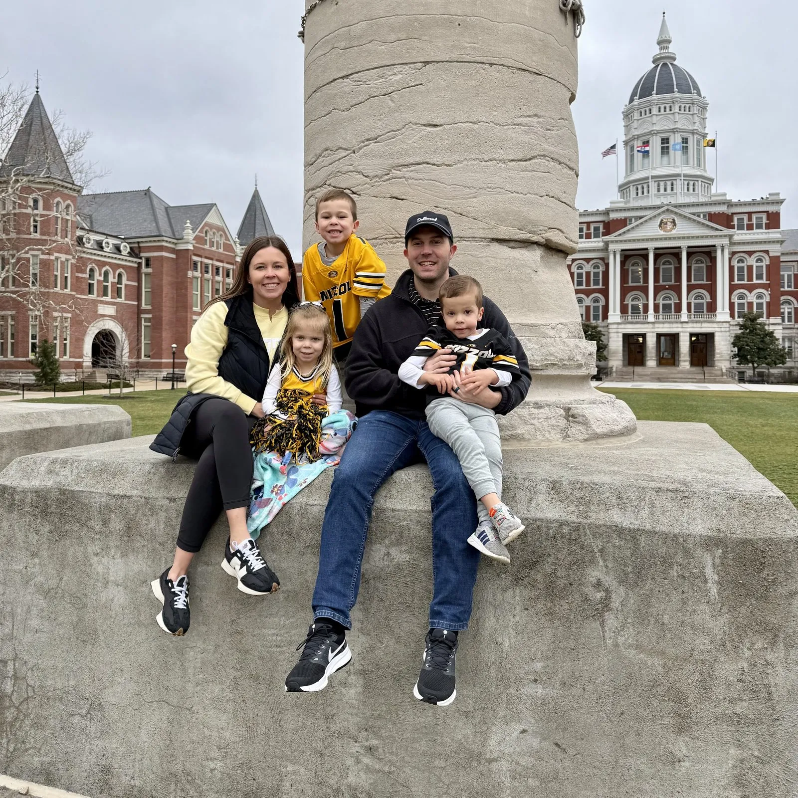 Madison Hayes, her husband and their kids at the Columns at the University of Missouri in 2026