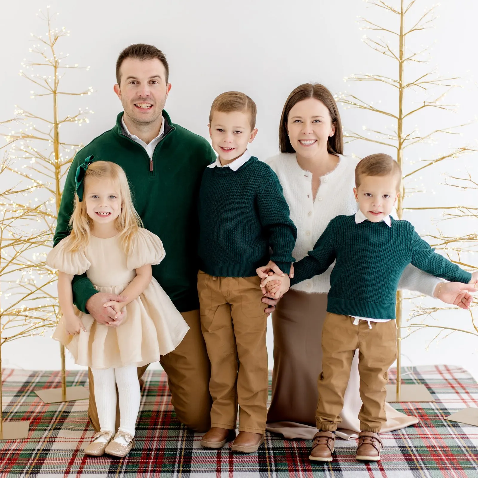 Madison Hayes with her husband and their three kids in a Christmas family photo