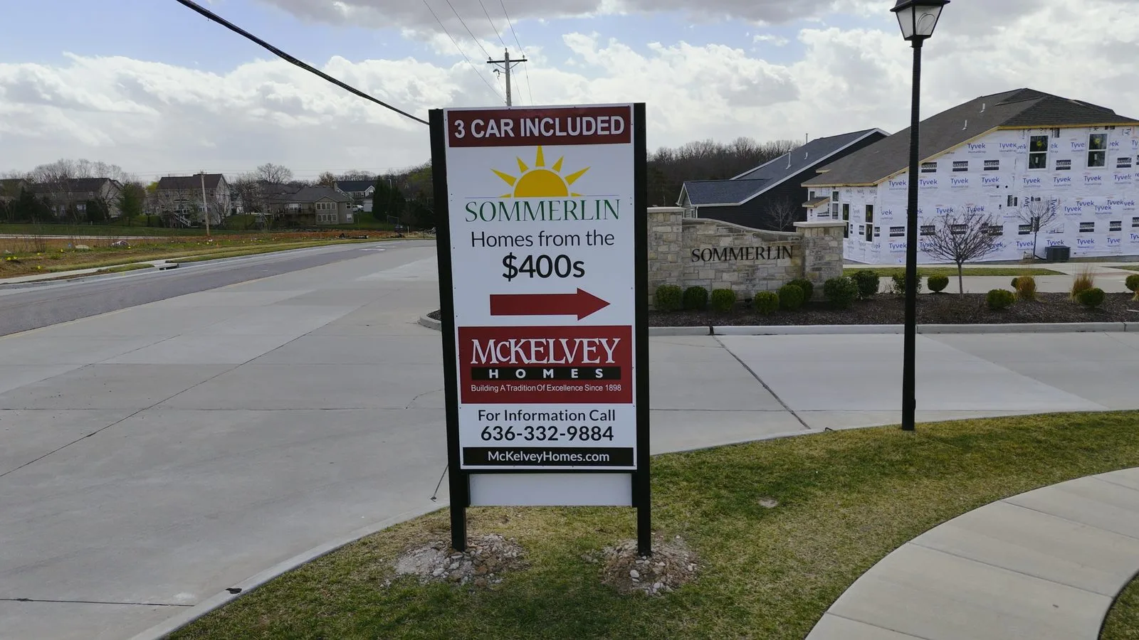Builder signage at the entrance to a new construction neighborhood advertising homes from the $400s