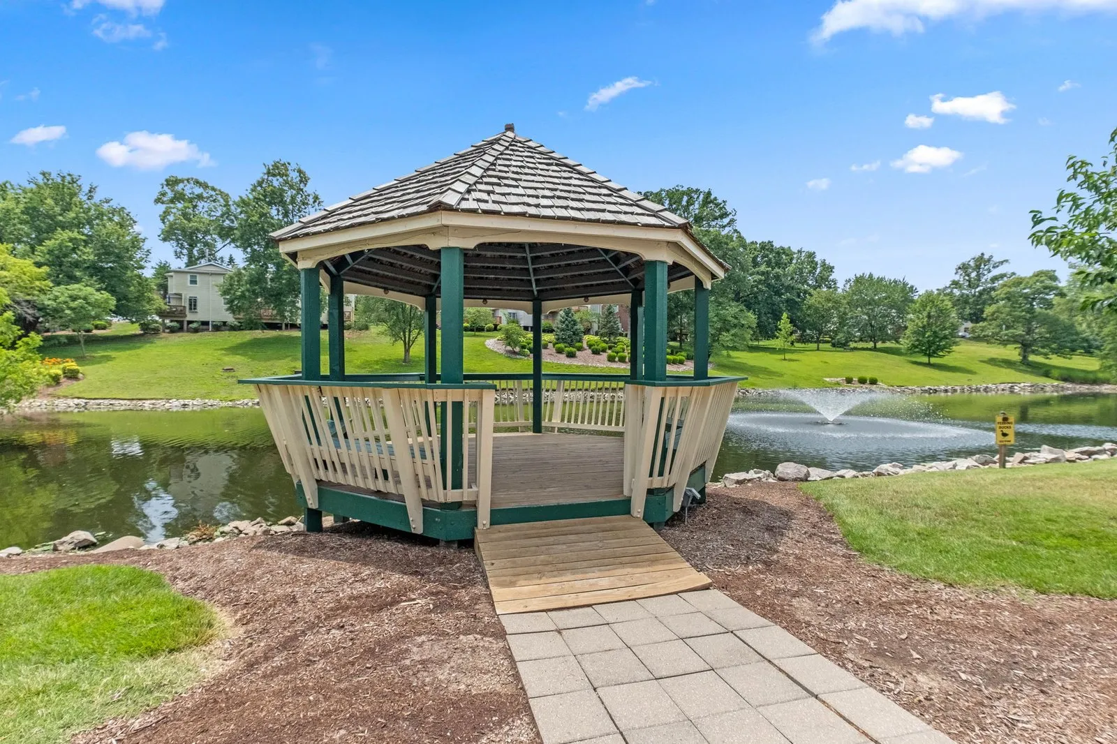 Neighborhood gazebo on a landscaped pond with a fountain at Brentwood Forest in the St. Louis area
