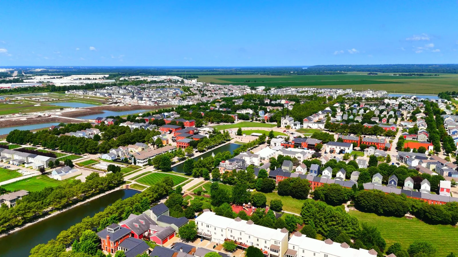 Aerial view over New Town at St. Charles, showing its lakes and colorful homes