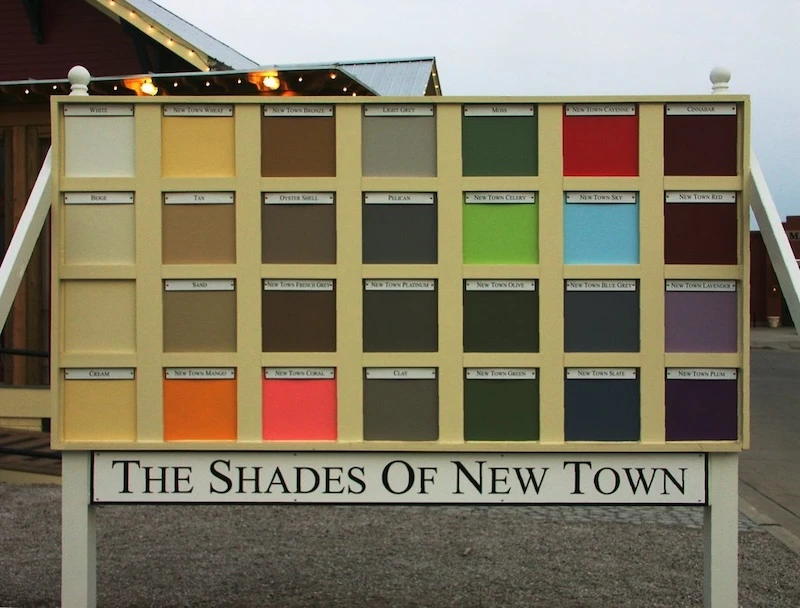 The “Shades of New Town” sign board displaying all 27 approved exterior paint colors with their names