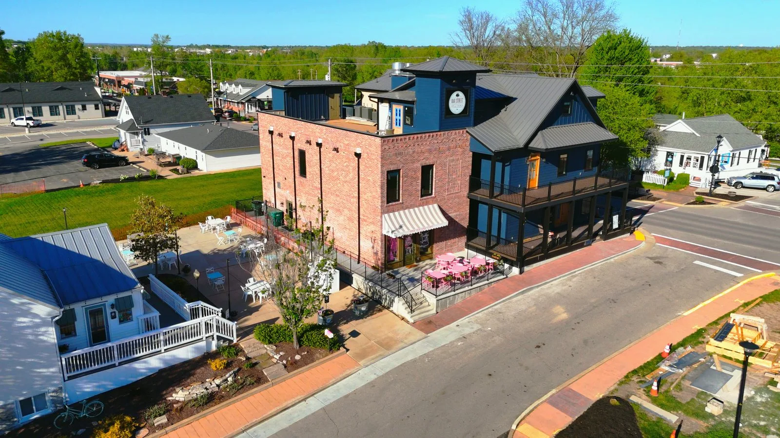 Drone view of the Oak Street Inn & Lounge and the Pink Willow Café patio beside it in Old Town Cottleville