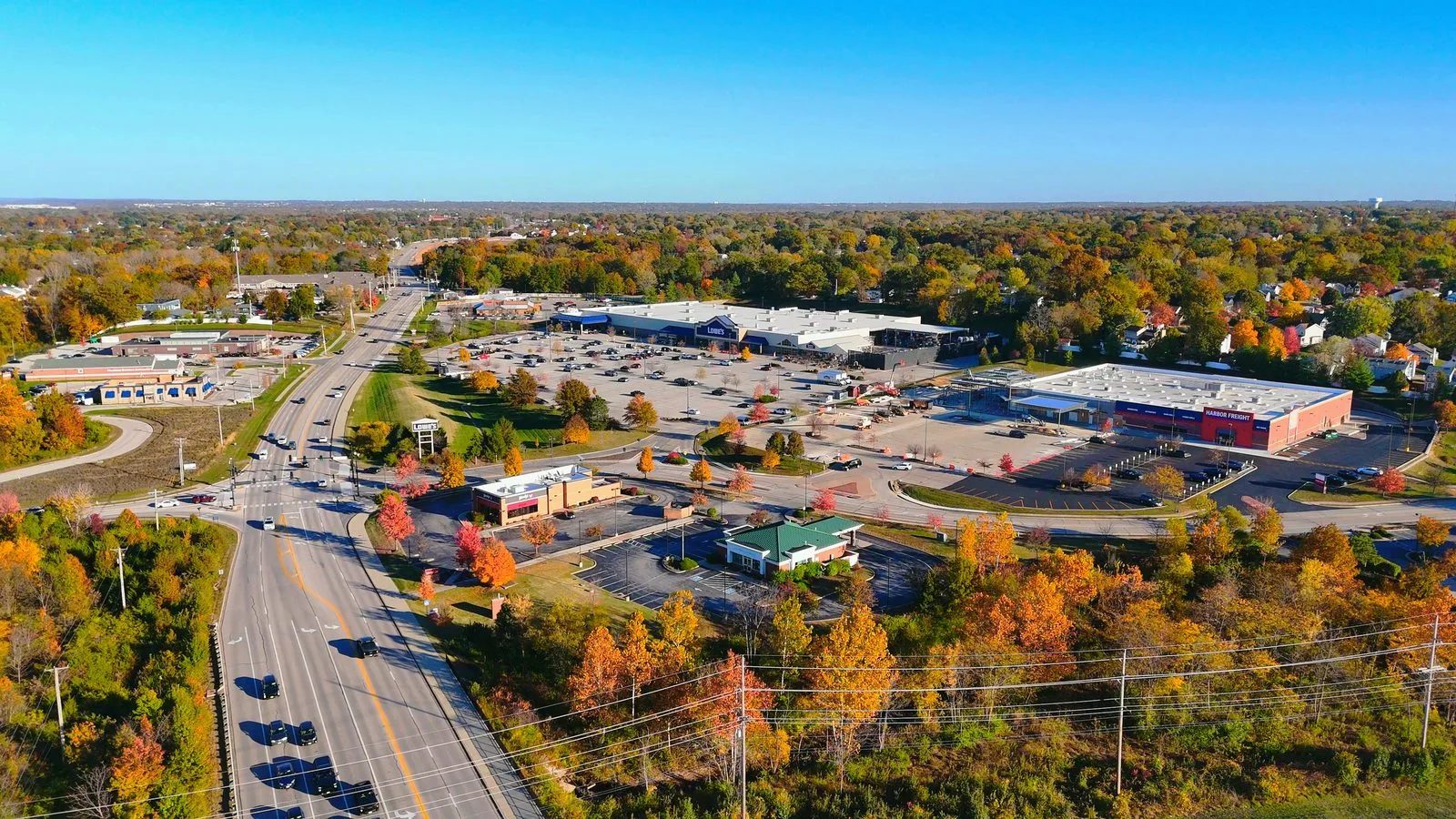 Aerial view of large chain stores and parking lots off Highway K near Mexico Road in O'Fallon, MO