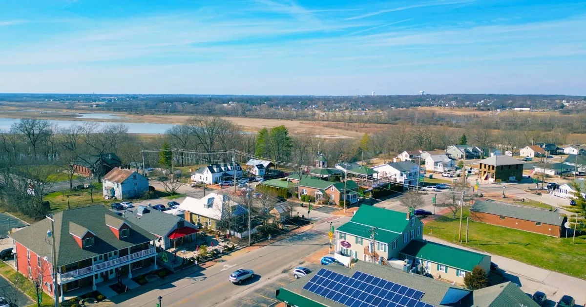 Aerial view of Old Town Cottleville along Highway N, with the shops and restaurants of the historic district and the Dardenne Creek bottoms beyond