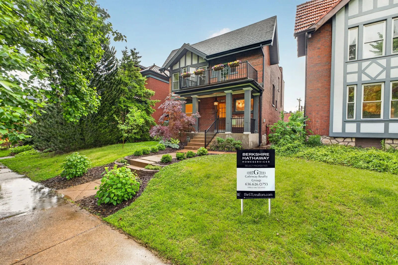 Gateway Realty Group yard sign on the lawn of a brick Tudor home in a St. Louis city neighborhood