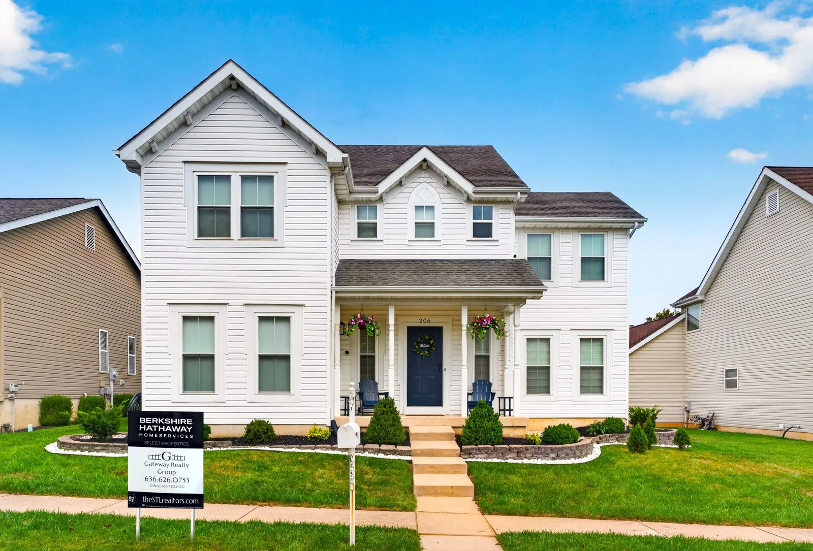 Gateway Realty Group yard sign in the front lawn of a two story home in a St. Charles County subdivision