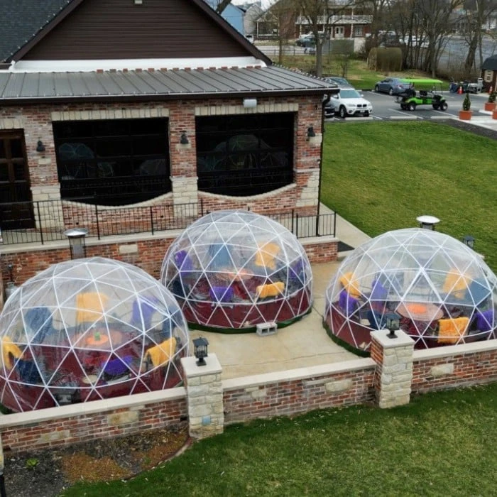 Three clear dining igloos on the patio at Public School House in Old Town Cottleville