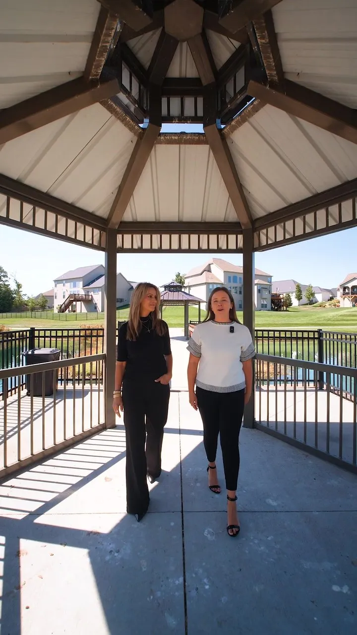 Vertical listing video of two Gateway Realty Group agents walking through the Shady Creek neighborhood pavilion