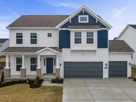 Santiago floor plan — white-and-navy two-story home with covered front porch
