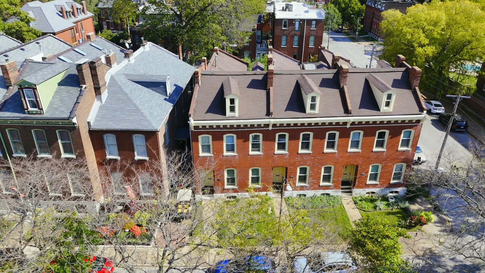 Historic attached red-brick homes on a street in Soulard, St. Louis