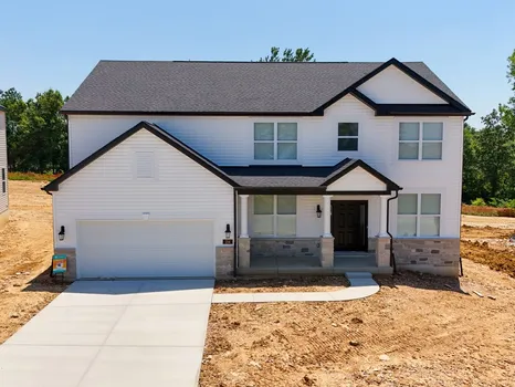 Sutton Farms new construction home by Lombardo Homes — white two-story with covered front porch