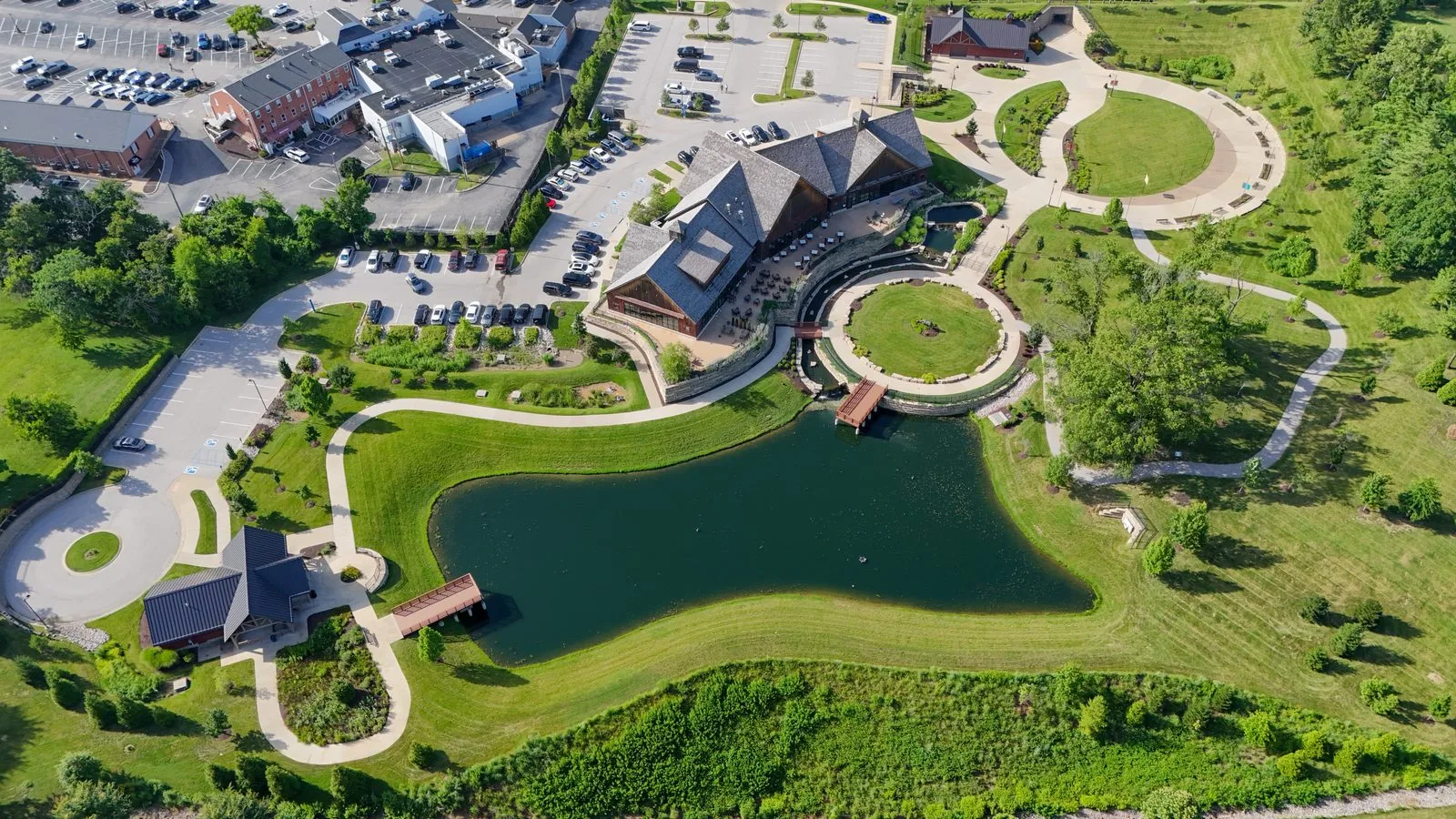 Aerial view of Town Square in Town and Country, with the pavilion, pond, footbridge and walking paths