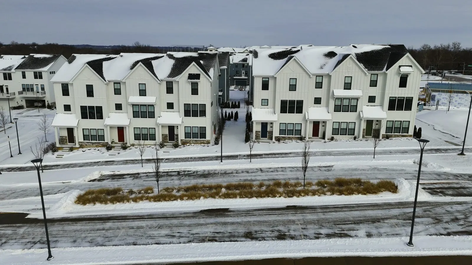 Aerial photo of completed townhomes at Wildhorse Village under snow