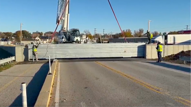 Workers in Eureka install a flood wall designed to reduce flooding