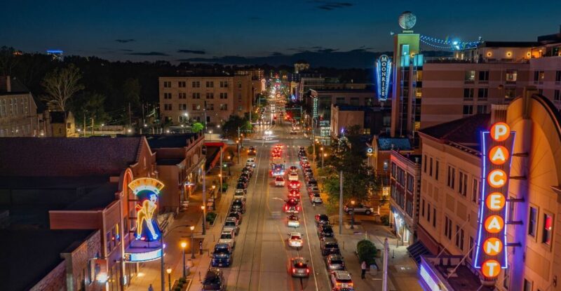 Drone shot of a lit up street at night